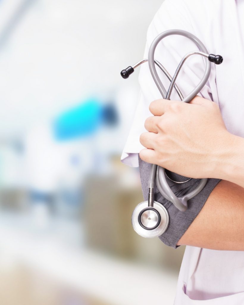 doctor-with-stethoscope-hands-hospital-background